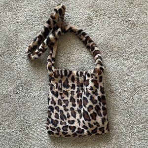 fuzzy leopard print cross body bag ! perfect condition; been used once :)